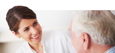 woman speaking with a resident