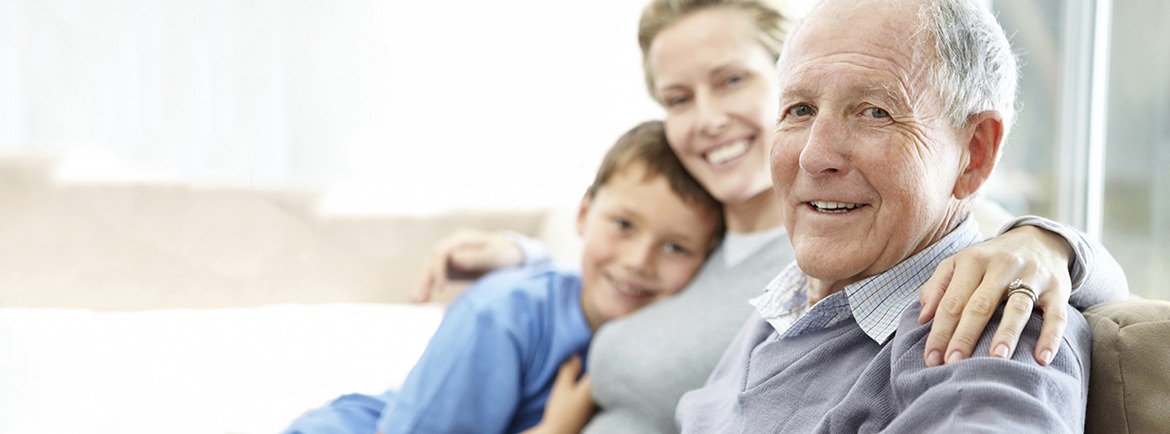 Senior man sitting with his daughter and grandson