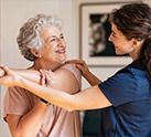 Rehab specialist helping senior women