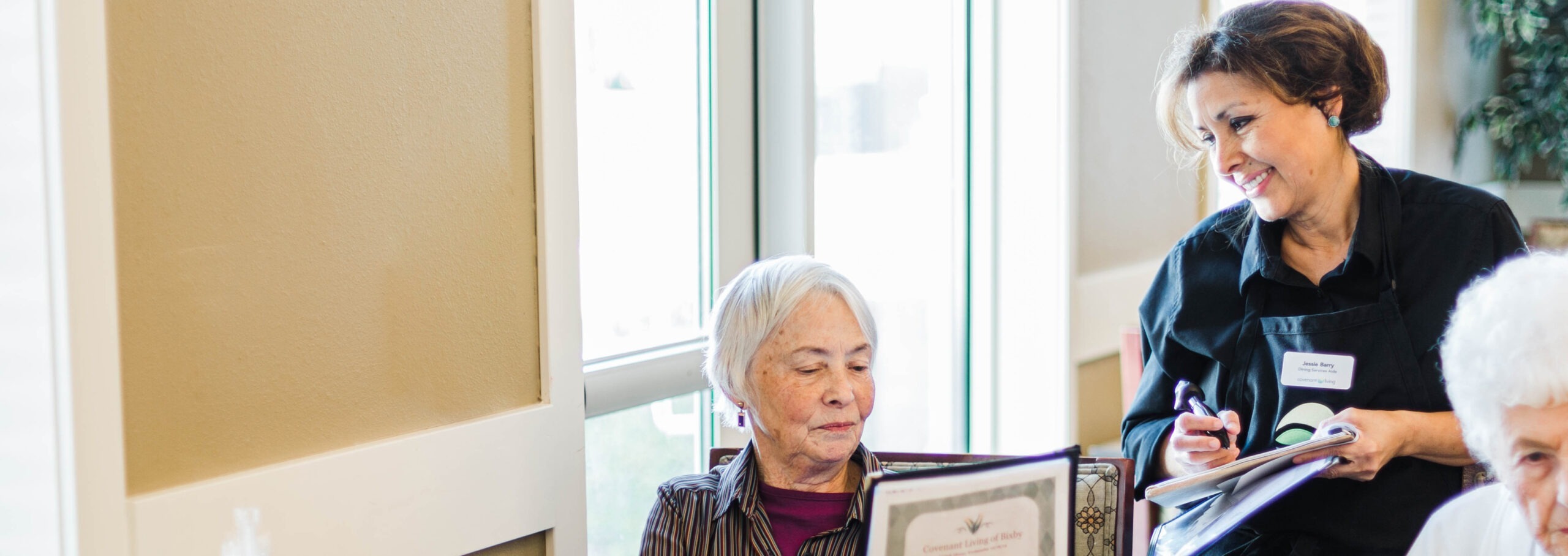 Caretaker reviewing documents with resident