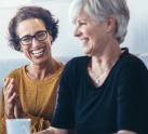 Woman laughing with friend