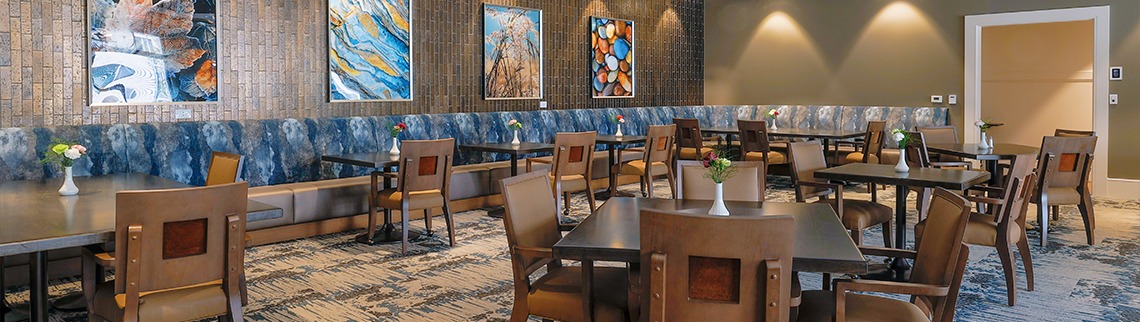 Dining tables and chairs in community dining room